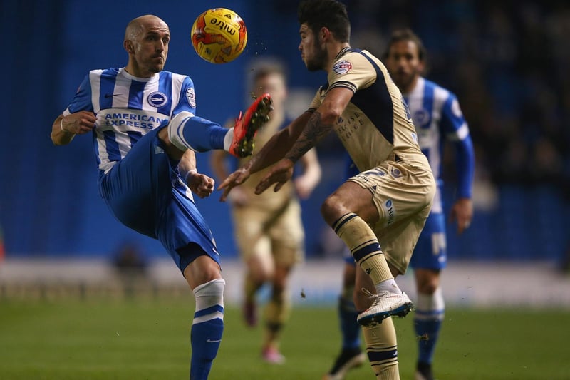 Alex Mowatt tries to tackle Brighton & Hove Albion's Bruno Saltor during the  Championship clash at the Amex in February 2015.