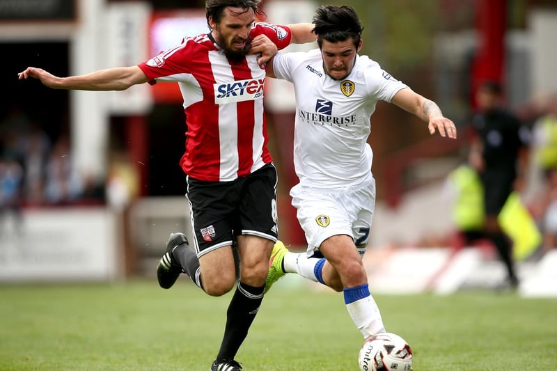 Alex Mowatt battles for the ball with Brentford's Jonathan Douglas during the Championship clash at Griffin Park in September 2014.