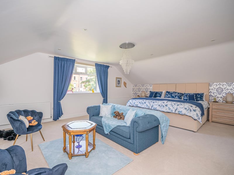 A bedroom with space for seating