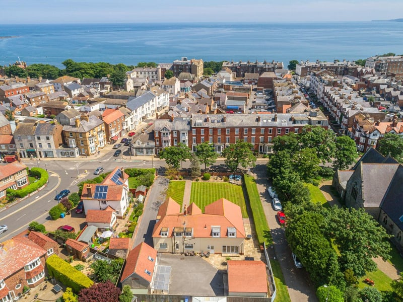 View over the house and town to the seascape beyond