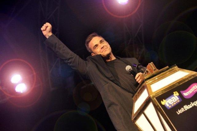 Former Take That man Robbie Williams entertains the crowds in 2010