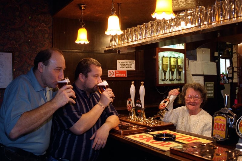 November 1995 Betty Sharp pulls a pint at the Grey Goose pub in Belle Isle watched by, from left, barman Mick Auty and landlord Carl Ward.