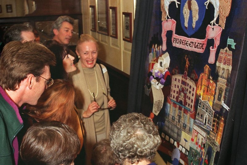 People gather round to get a closer look at the completed legal section of the Leeds Bayeaux Tapestry which was unveiled at the Metropole Hotel in September 1995.