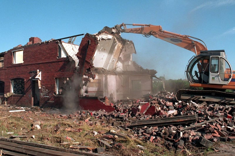 Work continued on tearing down derelict houses at Middleton Park Square in September 1995.