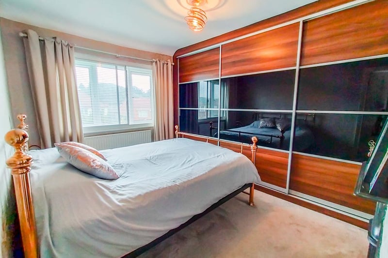 On the first floor there are three well proportioned bedrooms, including a superb master bedroom with fitted wardrobes and a feature fireplace.