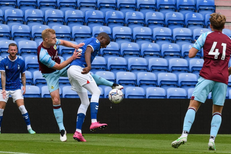 Ben Mee challenges for the ball