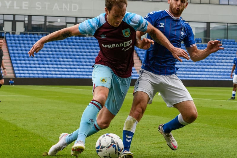 Ashley Barnes tries to shield the ball from his marker.