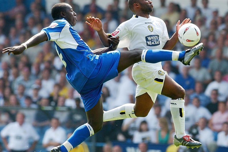 Striker Julian Joachim challenges for the ball with Derby County's Pablo Mills.