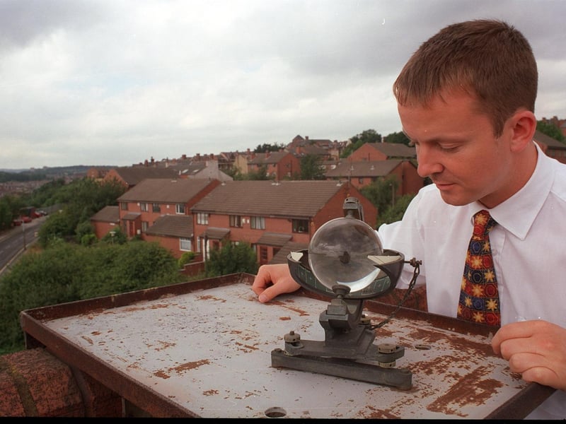 Paul Hudson checks an instrument for measuring sunlight at the Leeds Weather Centre.