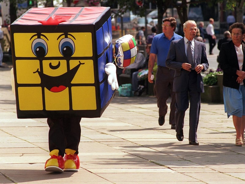 There were puzzled expressions in Victoria Gardens. The Rubik's cube people were in Leeds with the three dimensional problem and this giant version, complete with legs , was used to promote it.