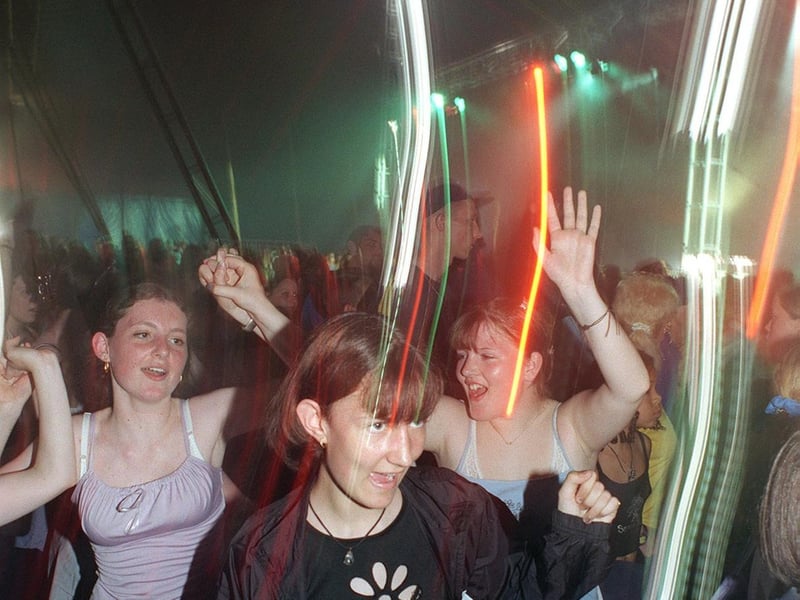 Young revellers enjoy the music in the dance tent.