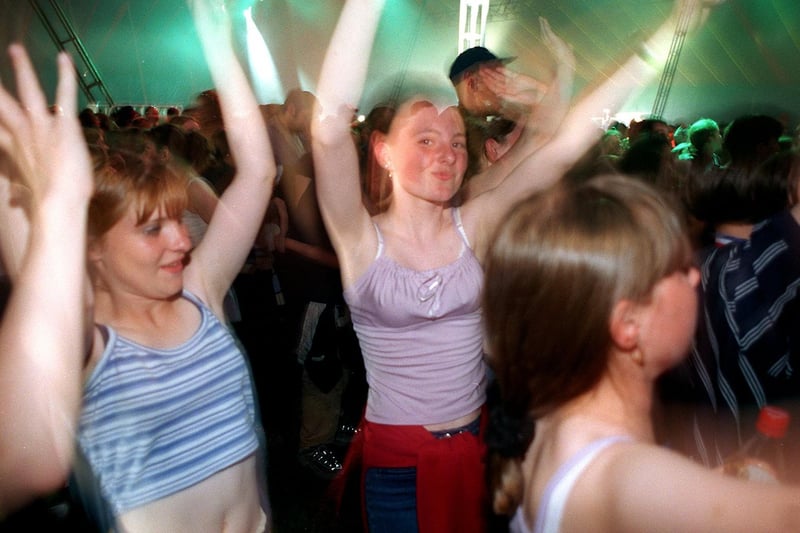 Young revellers enjoy the music in the dance tent.
