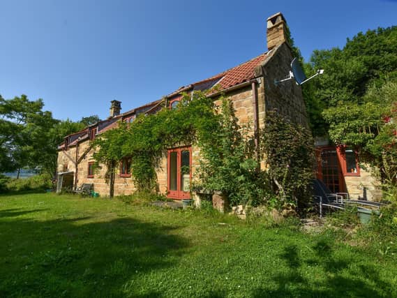 The characterful farmhouse stands within six acres of land