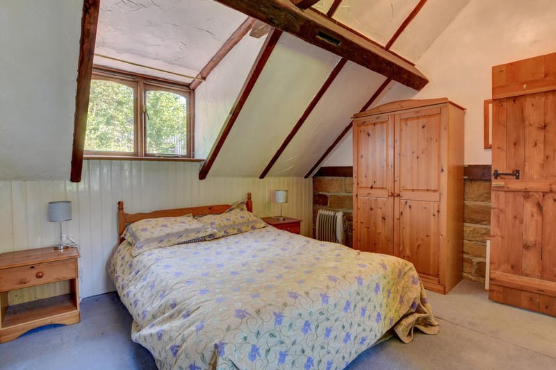 One of the farmhouse bedrooms,  with sloping roof