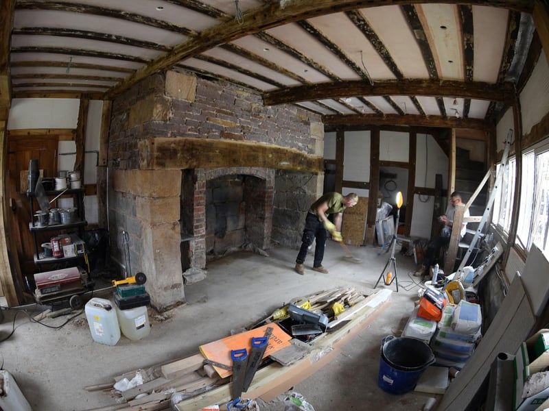 One of the main downstairs reception rooms, and one of the many fireplaces in the property