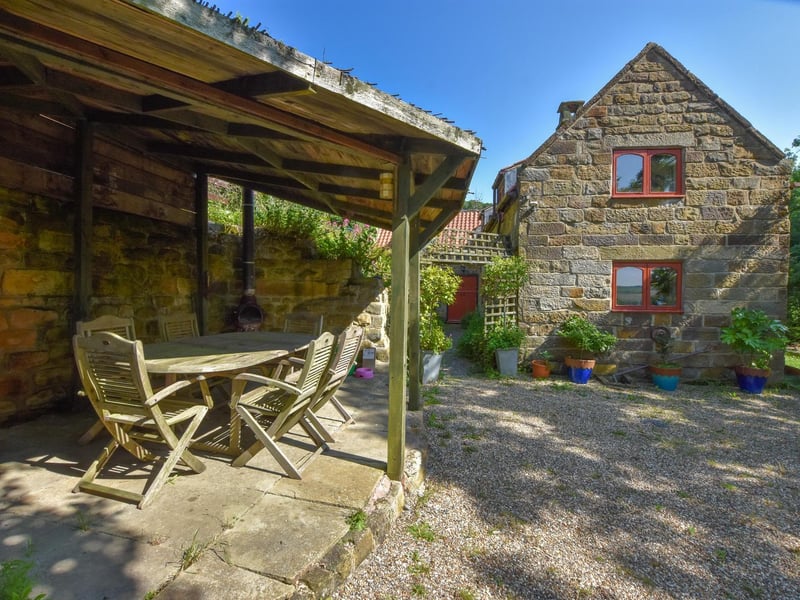 An outdoors seating area in the property's grounds