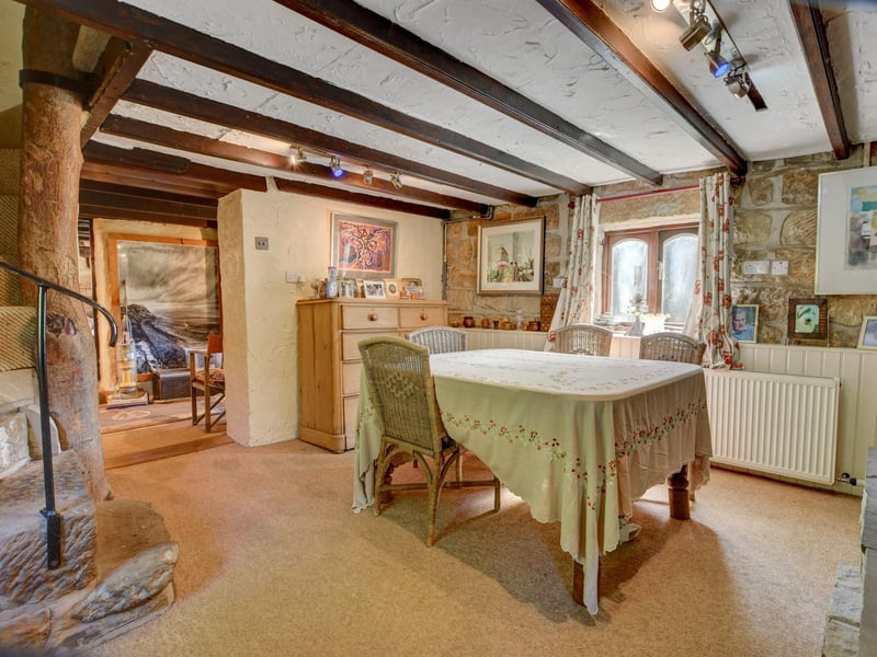 The dining room with a feature staircase to one corner