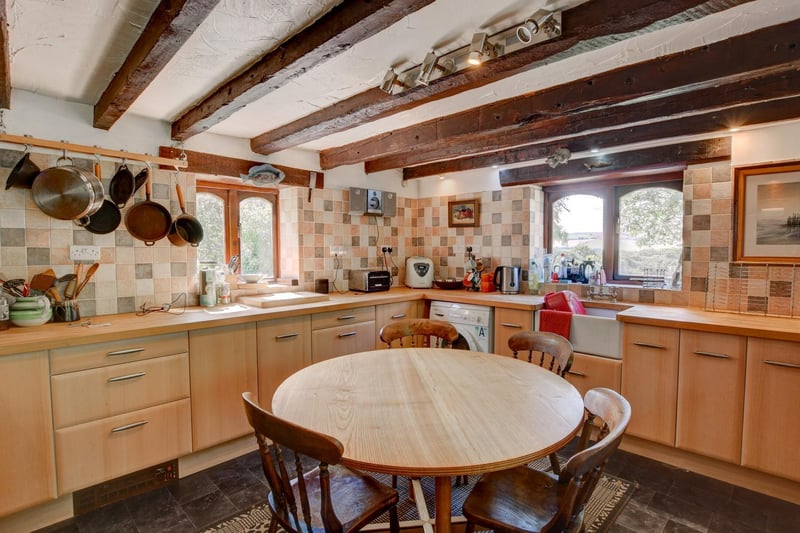 Plenty of space, storage and light within this beamed farmhouse kitchen