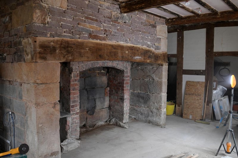 All the wooden beams are original, like this one above the fireplace