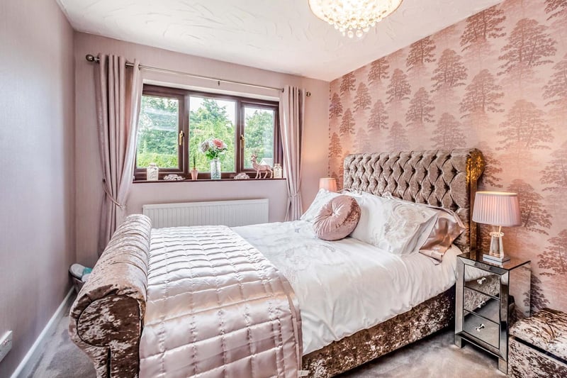 A stylish double bedroom within Avon Cottage