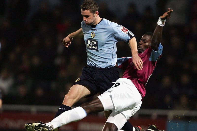 Frazer Richardson is tackled by West Ham United's Darren Powell during the Championship clash at Upton Park in December 2004.
