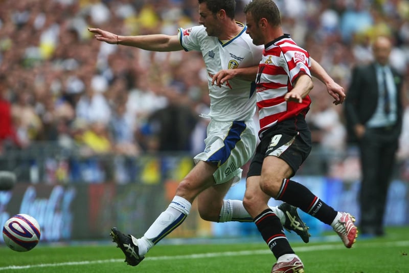 Richie Wellens of Doncaster Rovers is beaten to the ball by Frazer Richardson during the Coca Cola League 1 play-off final at Wembley in May 2008.
