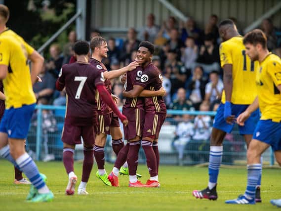 FIVE-GOAL THRILLER: Leeds celebrate going 2-1 up at Guiseley through Sam Greenwood's majestic free-kick. Picture by Bruce Rollinson.