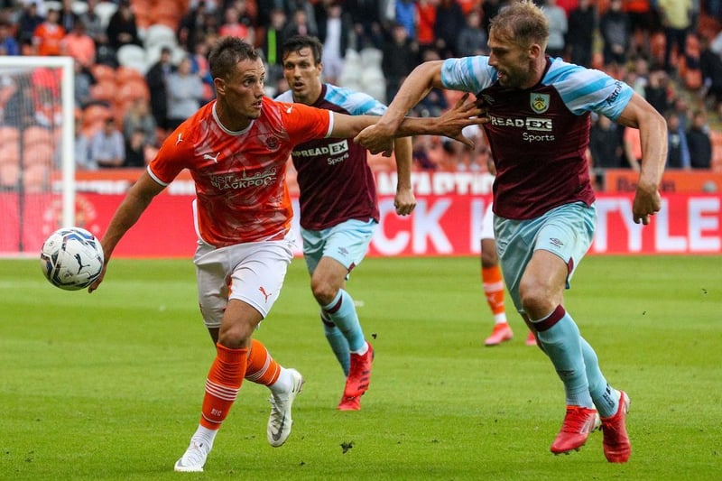 Blackpool's Jerry Yates shields the ball from Burnley's Charlie Taylor