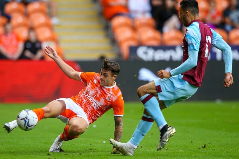 A Blackpool trialist battles with Burnley's Dwight McNeil