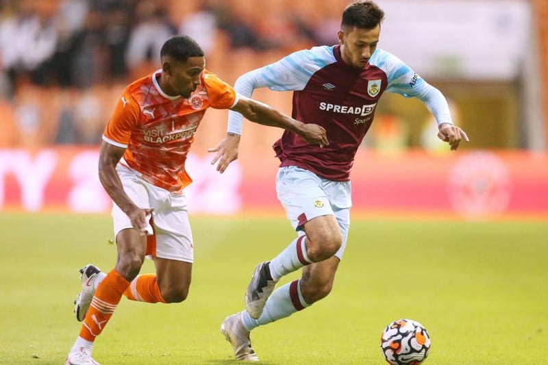 Dwight McNeil of Burnley battles for possession with Demetri Mitchell of Blackpool