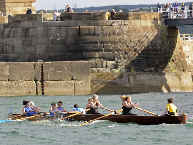 Teams battle it out in the rowing races.