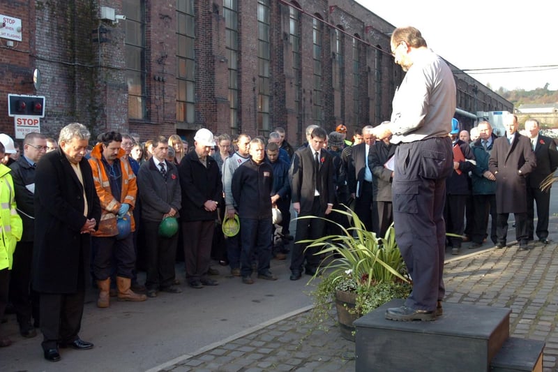 Reverend Bob Warwick hosts a brief service in front of the staff at Forgemasters where memorial plaques for deceased soldiers of the two world wars have been placed in 2007.

Photo: Barry Richardson