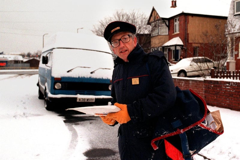 Postman Ian Kirkley has a cold job delivering mail in Cross Gates in December 1996.