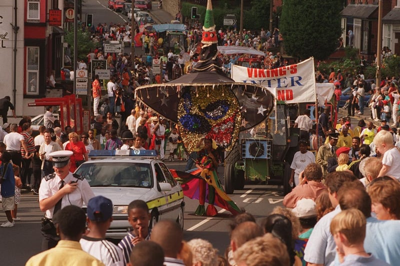 The Leeds West Indian Carnival parade makes its way down Harehills Lane.