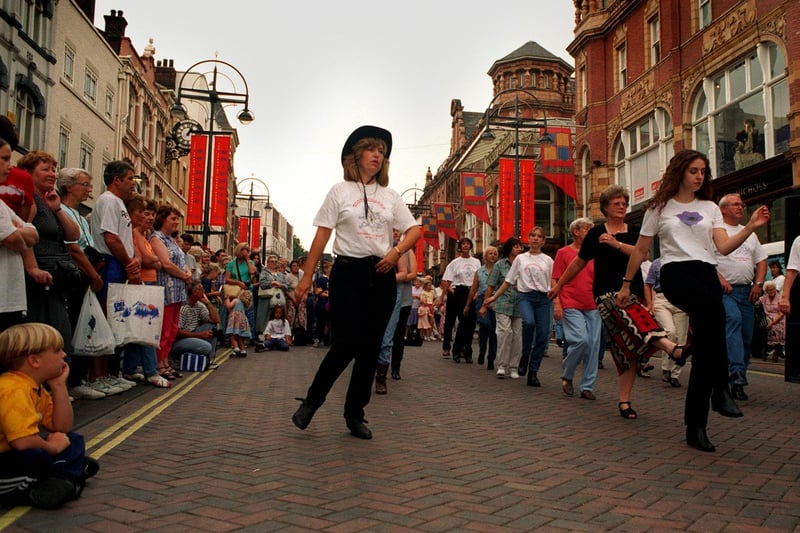 Line dancing took centre stage on Briggate. Pictured is Karen Edmonds (centre) of the Edmonds Dance School leading from the front.