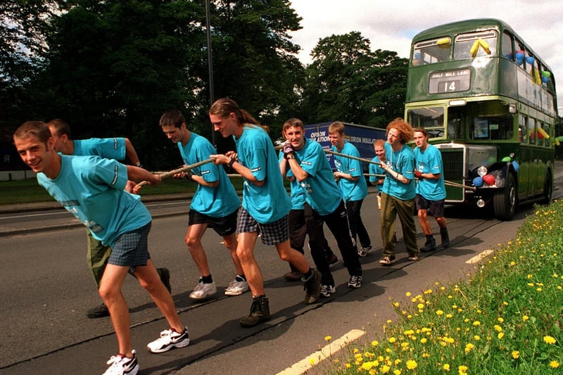 Fundraisers are pictured during a bus pull from Lawnswood to Leeds city centre to raise money for the Raleigh International Millennium Awards Scheme.