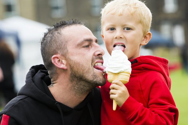 Shaun Clayton tries to steal a lick of six-year-old Harley Doren's ice-cream.