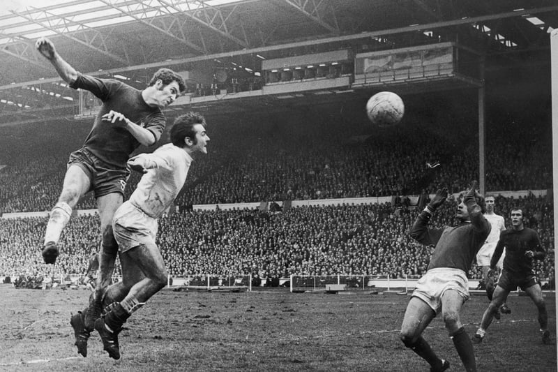 Terry Cooper, second right, challenges Peter Osgood in the 1970 FA Cup final against Chelsea as Whites team mate Jack Charlton, second from right, looks on. Photo by Douglas Miller/Getty Images.