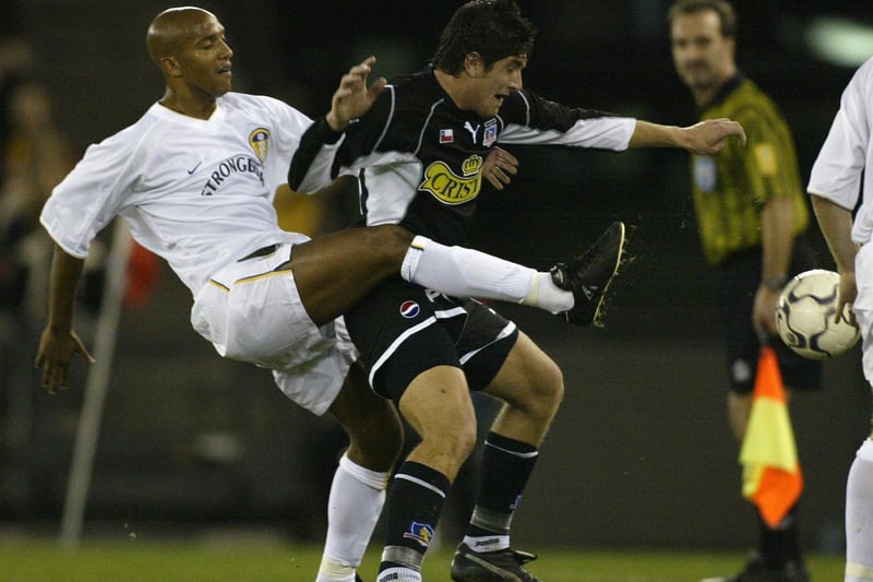 Oliver Dacourt clears the ball under pressure from Colo Colo's Miguel Aceyai.