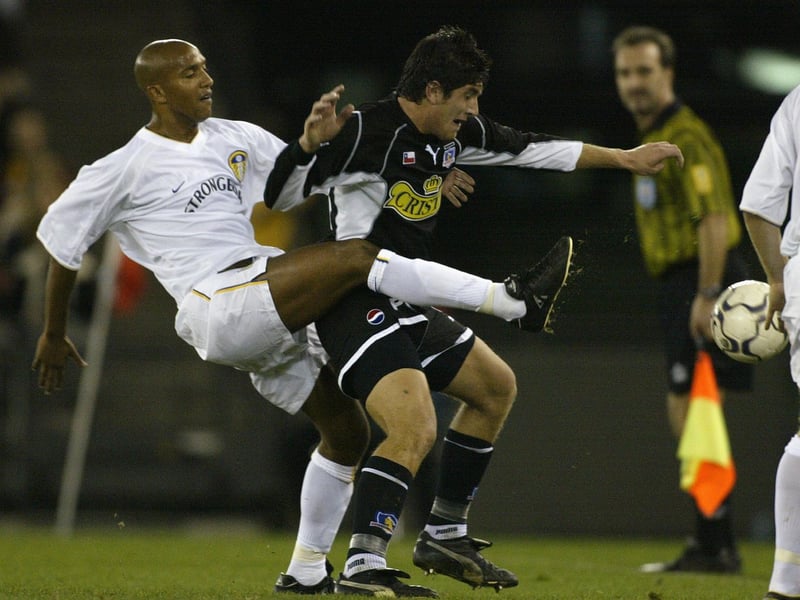 Oliver Dacourt clears the ball under pressure from Colo Colo's Miguel Aceyai.