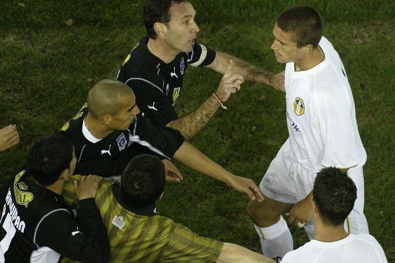 Tempers fray as Harry Kewell argues with Colo Colo's Marcello Espina.