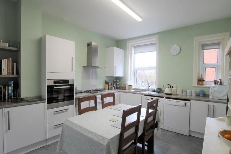 This spacious kitchen offers a range of modern wall & base units with complementary work surfaces, integrated Zanussi oven, 4 ring gas hob, Zanussi cooker hood, stainless steel sink with mixer tap and drainer, plumbing for washing machine and dishwasher, tiled effect laminate flooring and 2 UPVC double glazed windows.