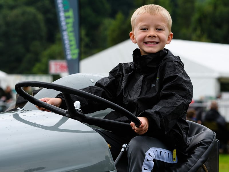 Charlie Turnbull tries out a vintage tractor at the Royal Lancashire Agricultural Show 2021.