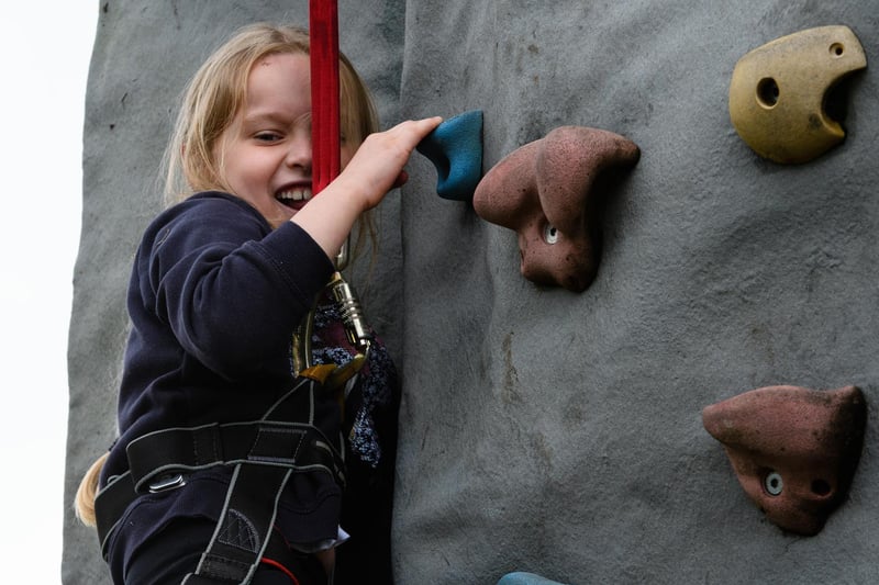 Elivia Eastham (7) on the climbing wall at the Royal Lancashire Agricultural Show 2021.