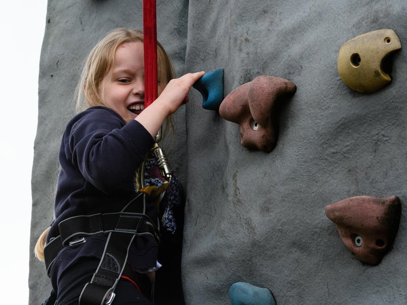 Elivia Eastham (7) on the climbing wall at the Royal Lancashire Agricultural Show 2021.
