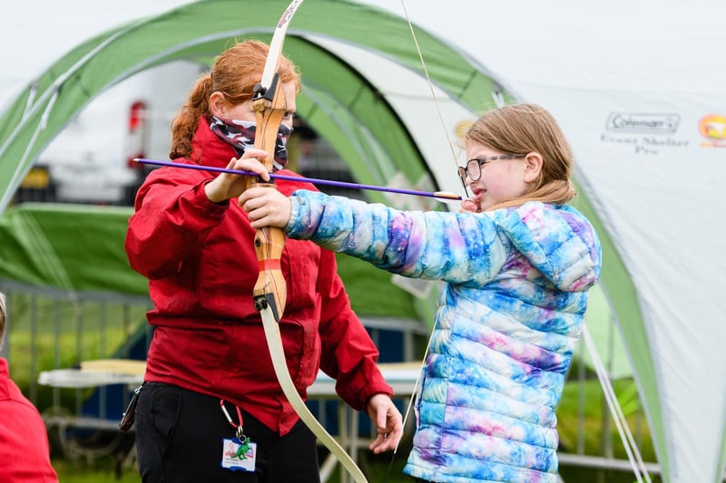 Lottie Hopcraft (9) tries out archery at the Royal Lancashire Agricultural Show 2021.