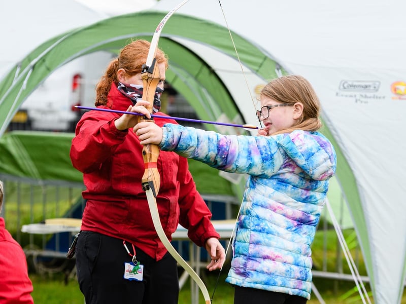Lottie Hopcraft (9) tries out archery at the Royal Lancashire Agricultural Show 2021.