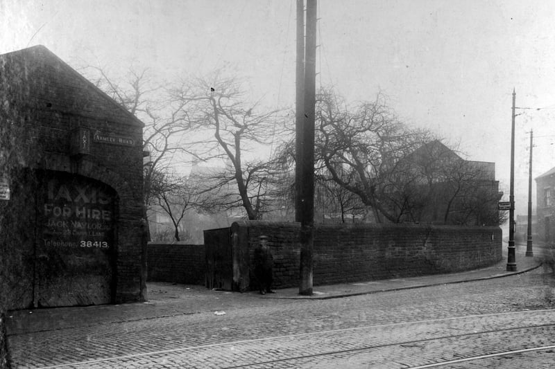 Armley Road at the junction with Crab Lane in February 1929. A man is pictured outside the entrance to 'Taxis for hire', owned by Jack Naylor.