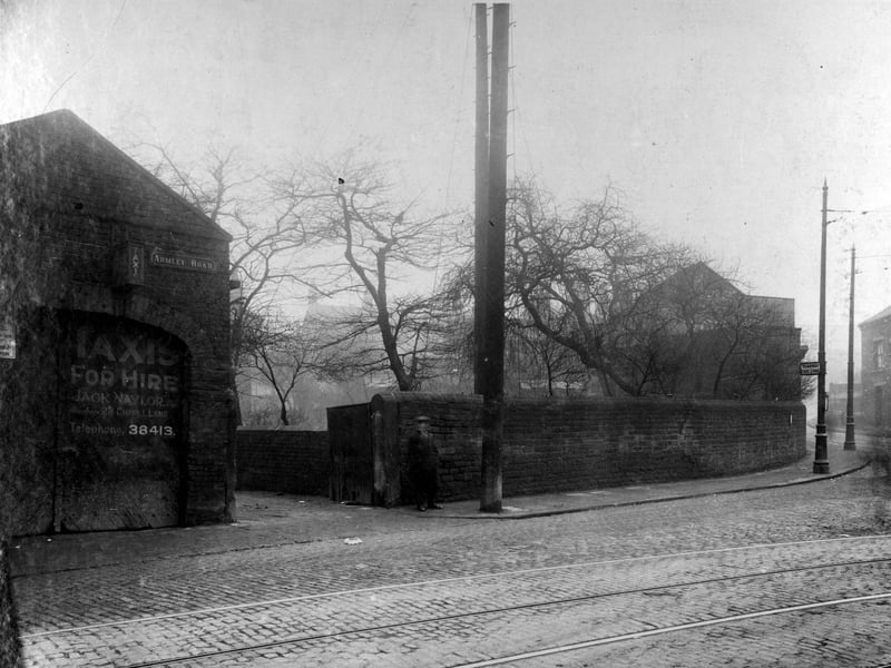 Armley Road at the junction with Crab Lane in February 1929. A man is pictured outside the entrance to 'Taxis for hire', owned by Jack Naylor.