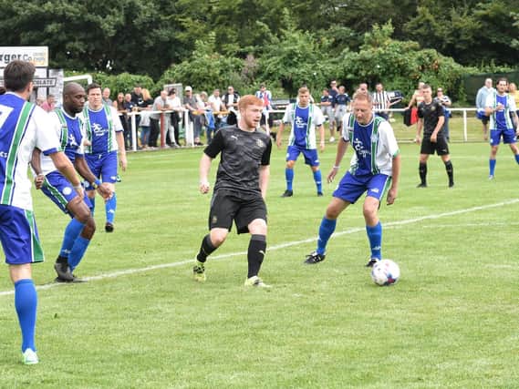 Action from the Joseph's Goal legends game at Ashton Town